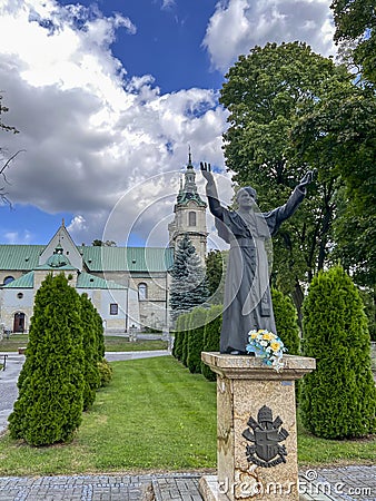 JEDRZEJOW, POLAND - September 1, 2023: Statue of Saint Pope John Paul II in front of the Cistercian Archabbey in Jedrzejow, Poland Editorial Stock Photo