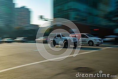 Jeep crossing intersection in downtown Vancouver Editorial Stock Photo