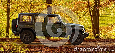 Jeep Wrangler driving a forest road Editorial Stock Photo