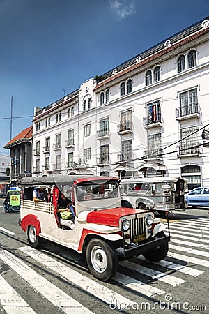 jeepney bus local transport traffic in downtown manila city street philippines Editorial Stock Photo