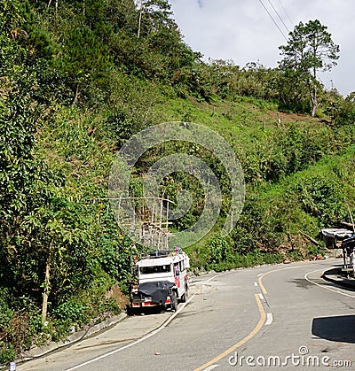 A jeepney on rural road in Banaue, Philippines Editorial Stock Photo