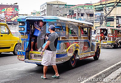 Jeepneys on street in Manila, Philippines Editorial Stock Photo