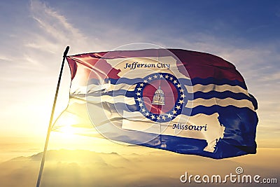 Jefferson city capital of Missouri of United States flag textile cloth fabric waving on the top sunrise mist fog Stock Photo