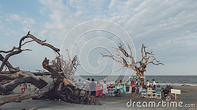 JEKYLL ISLAND, GEORGIA - SEPT 17, 2019: A wedding ceremony driftwood beach Editorial Stock Photo