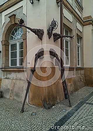 Stilt walker statue in building walls Editorial Stock Photo