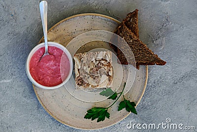 Jellied meat with horseradish on a wooden board.style hugge Stock Photo