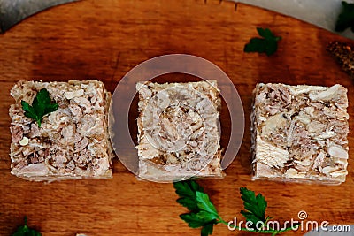 Jellied meat with horseradish on a wooden board.style hugge Stock Photo