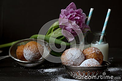 Jelly doughnuts, tulip and two bottles of milk Stock Photo