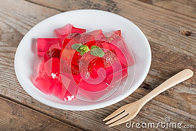 Jelly strawberry with fresh strawberry slices. Stock Photo