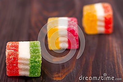 Jelly sweet, flavor fruit, candy dessert colorful on wood background Stock Photo