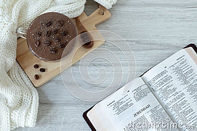 Jeremiah open holy bible book with coffee cup on table, top view Stock Photo