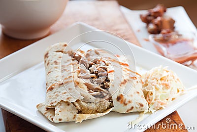 Jerk Chicken in Roti - Caribbean Style Stock Photo