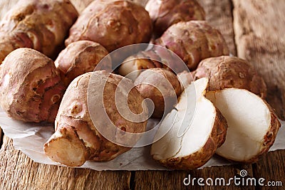 Jerusalem artichoke also called sunroot, sunchoke, earth apple, or topinambour close-up. horizontal Stock Photo