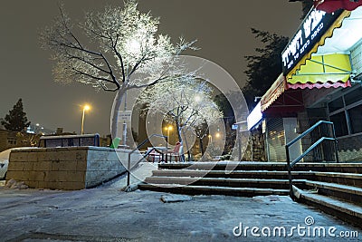 The commercial center of the Givat Mordechai neighborhood is covered in snow on a night of snowstorms Editorial Stock Photo