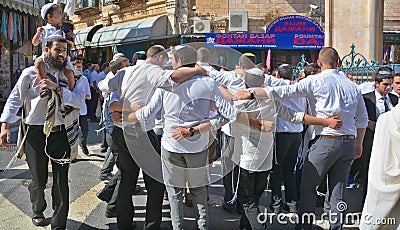 Jewish men celebrate Simchat Torah. Editorial Stock Photo