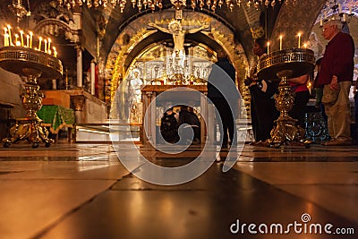 Praying women in the Church of the Holy Sepulcher. Blurred background Editorial Stock Photo