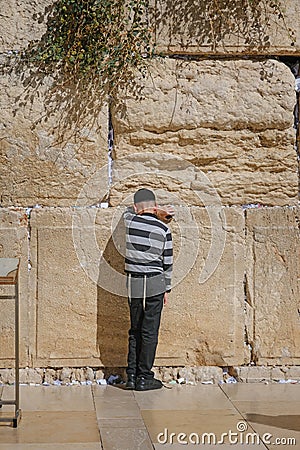 Jerusalem, Israel - October 5, 2022 :Jewish child prays in the Wailing Wall of Jerusalem Editorial Stock Photo