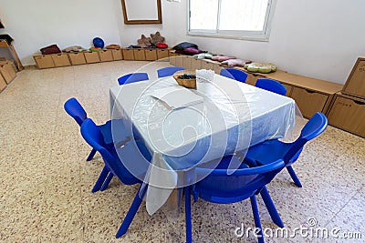 A small kindergarten table and chairs, inside an Israeli kindergarten in Jerusalem Stock Photo