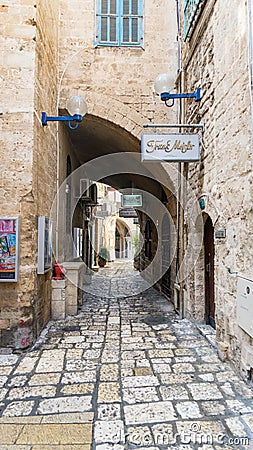 Jerusalem white stone house on narrow street of Old Yafo Jaffa. Tel Aviv, Israel. Editorial Stock Photo