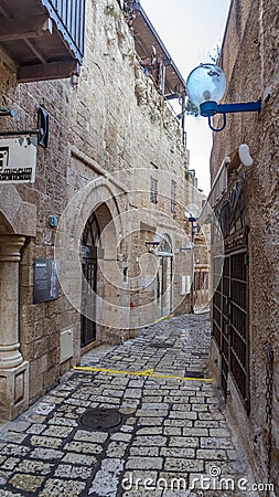 Jerusalem white stone house on narrow street of Old Yafo Jaffa. Tel Aviv, Israel. Editorial Stock Photo