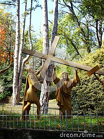 Jesus carry cross statue at Lourdes, France Stock Photo