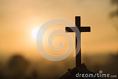 Jesus Christ cross. Easter, resurrection concept. Christian wooden cross on a background with dramatic lighting Stock Photo