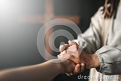 Jesus Christ gives a helping hand to the faithful Stock Photo