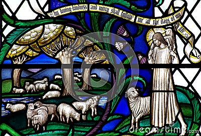 Jesus Christ the Good Shepherd with sheep in stained glass Stock Photo