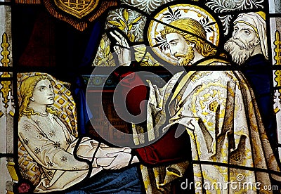 Jesus Christ healing a sick girl in stained glass Stock Photo