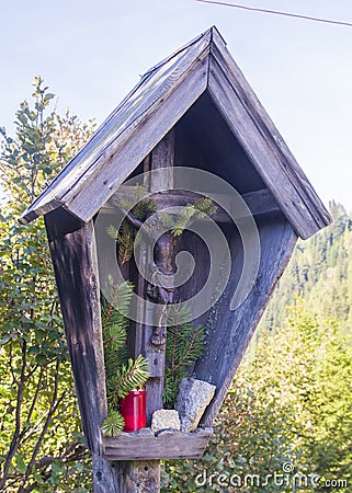 Jesus christ, wooden crucifix, spontaneous religiosity of the mountain people Stock Photo