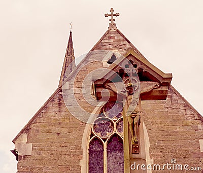 Jesus On Cross With Victorian Church In Background Haze Stock Photo