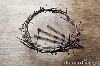 Jesus Crown Thorns and nails on Old and Grunge Wood Background. Vintage Retro Style. Stock Photo