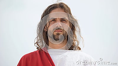 Jesus crying and looking into camera, feeling compassion for people, mercy Stock Photo