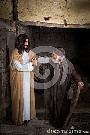 Jesus curing the crippled man Stock Photo