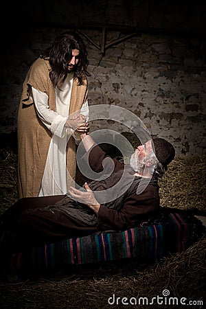 Jesus healing the crippled man Stock Photo