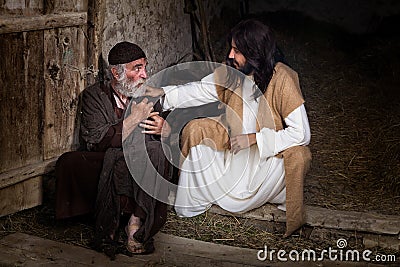 Jesus healing the lame old man Stock Photo