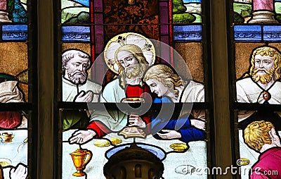 Jesus at Last Supper on Maundy Thursday - Stained Glass in Mechelen Cathedral Stock Photo