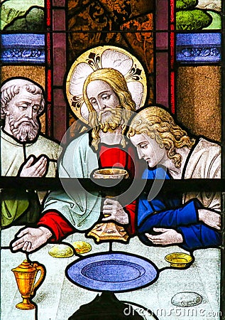 Jesus at Last Supper on Maundy Thursday - Stained Glass in Mechelen Cathedral Stock Photo