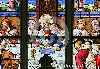 Jesus at Last Supper on Maundy Thursday - Stained Glass in Mechelen Cathedral Stock Photo