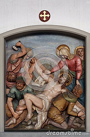 Jesus is nailed to the cross, 11th Stations of the Cross Editorial Stock Photo