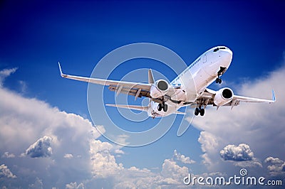 Jet Aeroplane Landing Through Gap in Stormy Sky Stock Photo