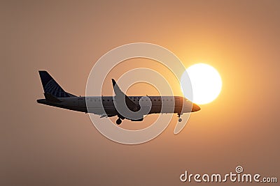 Jet Airline Flying through Smoke Filled Skies Editorial Stock Photo