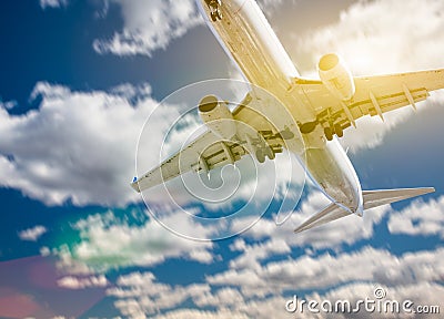 Jet Airplane Landing with Dramatic Clouds Behind Stock Photo