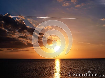 Jet Contrail over Lake Okeechobee Sunset Stock Photo