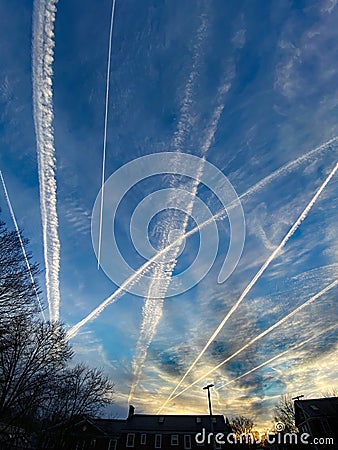 Jet Contrails at Sunset in the Neighborhood Stock Photo