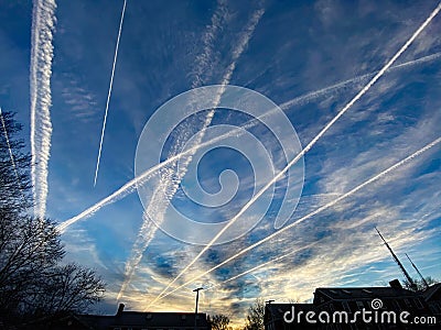 Jet Contrails at Sunset in the Neighborhood in Washington DC Stock Photo