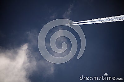 Jet plane above clouds turbulence vacation wing . Stock Photo