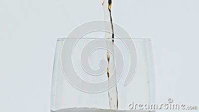 Jet pouring foamy beer vessel slow motion. Barley alcohol drink glassware macro Stock Photo