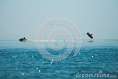 Jet ski silhouette, extreme entertainment, vacation at sea, Stock Photo