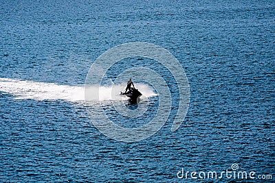 Jet Ski Sillouette on Blue Stock Photo